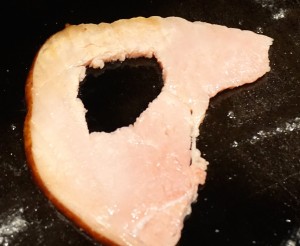 Cut a hole in a large piece of ham.